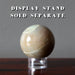 cream moonstone sphere on stand