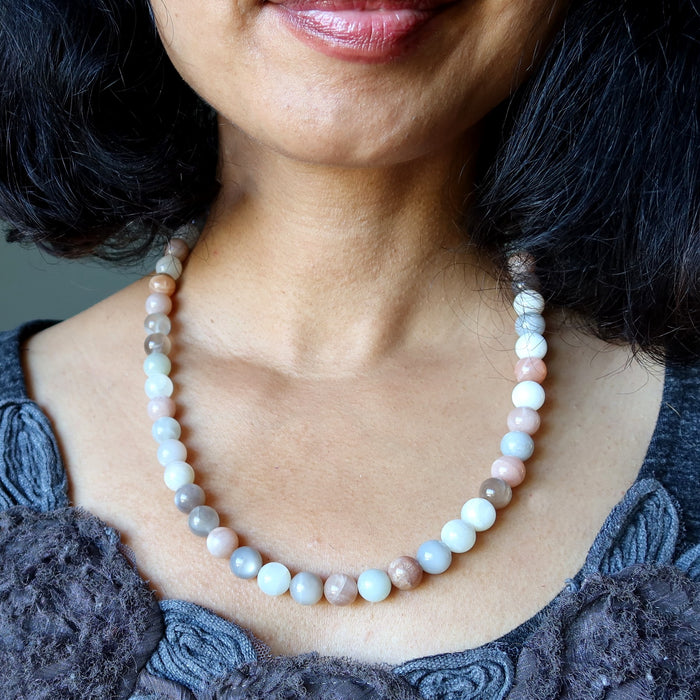 Moonstone Necklace with multicolored beads worn by a person against a neutral background