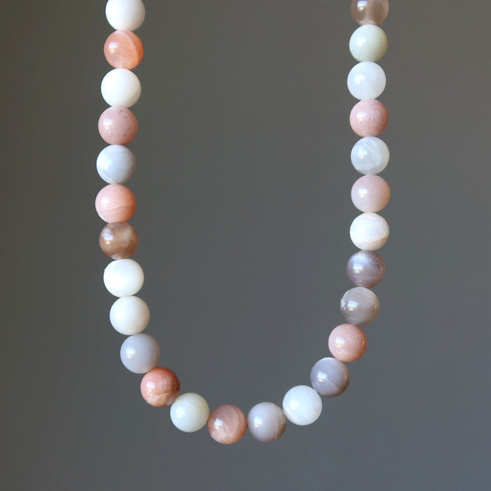 Moonstone Necklace with multicolored beads on a gray background