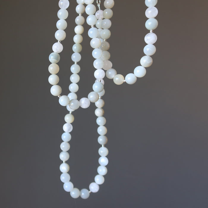 White Moonstone Necklaces on a dark gray background