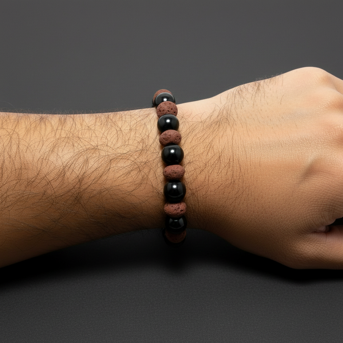 obsidian lava bracelet on hairy male wrist