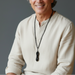 man wearing dorje necklace