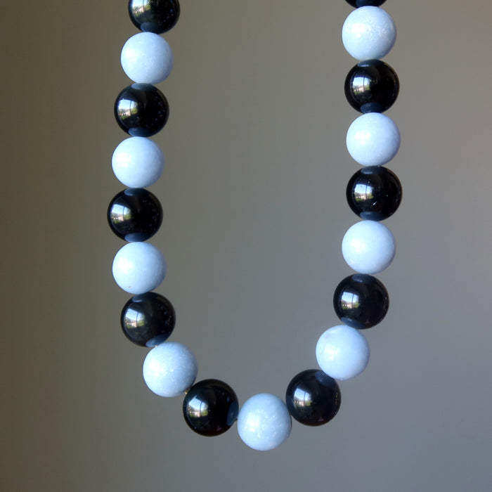 Necklace with alternating black obsidian and light blue angelite beads