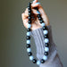 Necklace with alternating black obsidian and light blue angelite beads