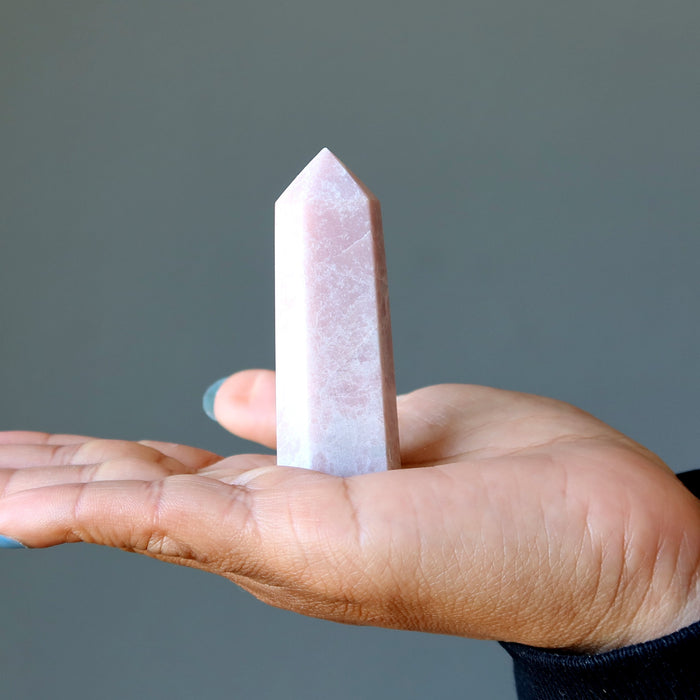 pink opal crystal tower wand in palm