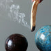 palo santo stick smoke and crystal balls