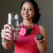woman holding water and moqui marble