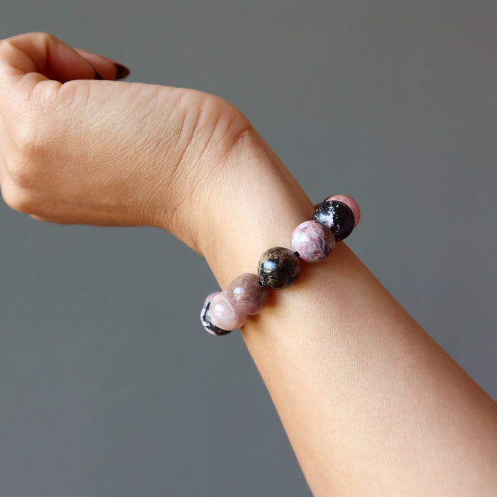 rhodonite bracelet on wrist