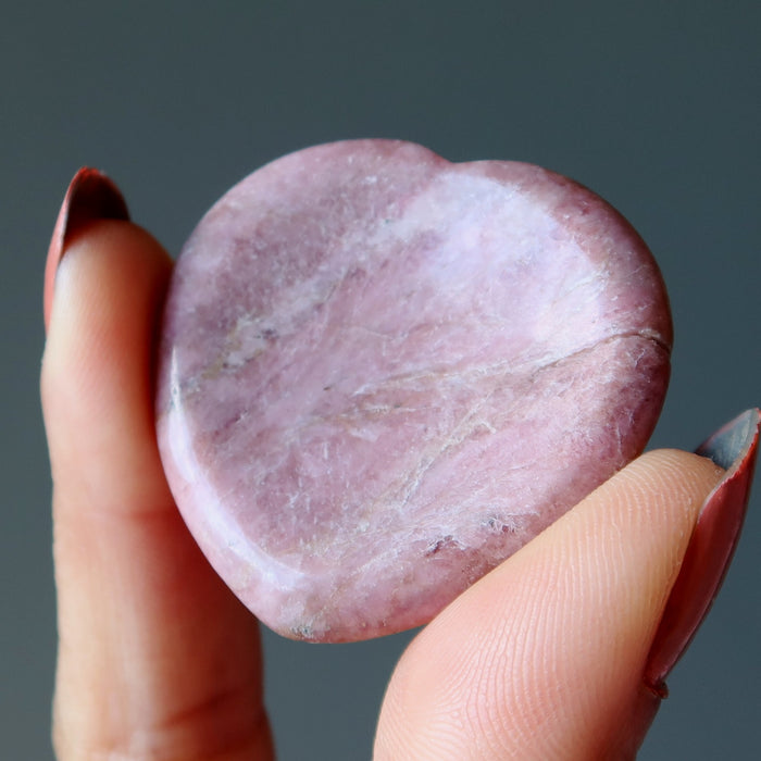 Holding Pink Rhodonite Worry Stone 