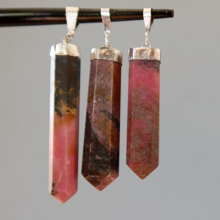 three rhodonite point pendants