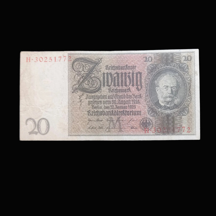 A vintage German 20 Reichsmark banknote displayed flat against a dark textured background.