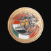 Decorative coin with Italian National Contingent Command Land emblem on a dark background