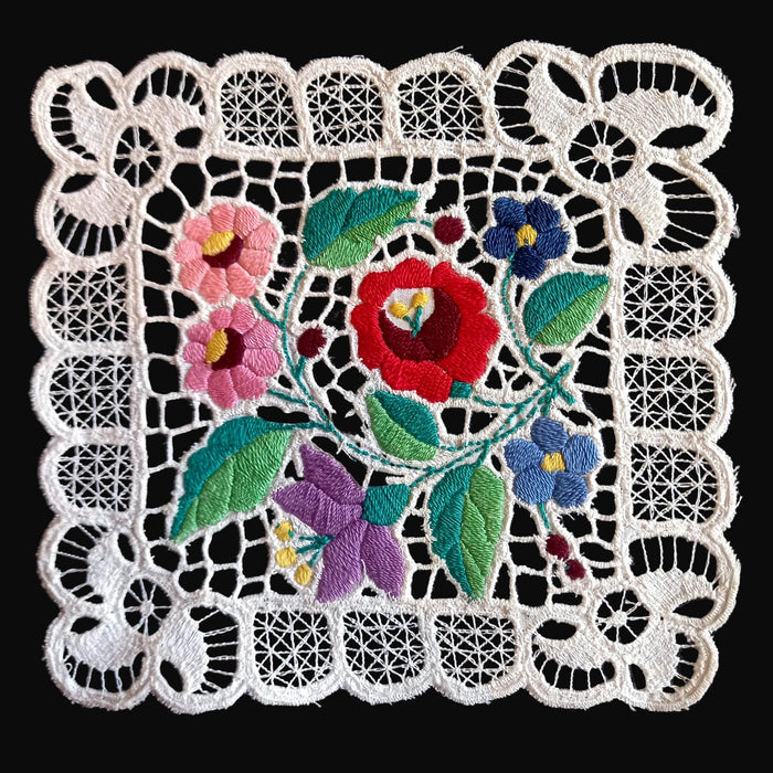 vintage hungarian 1970 Embroidered floral design on a black background 