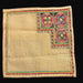Beige embroidered fabric patch with geometric star patterns from Great Plains of Hungary on a dark background