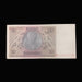 A vintage 20 Reichsmark banknote from Germany, displayed flat against a dark textured fabric background.