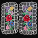 Pair of vintage hungarian kalocsa lace doilies with floral designs on a black background