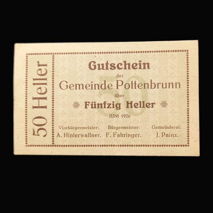 Vintage German banknote from Gemeinde Pottenbrunn with text and numbers on a dark background