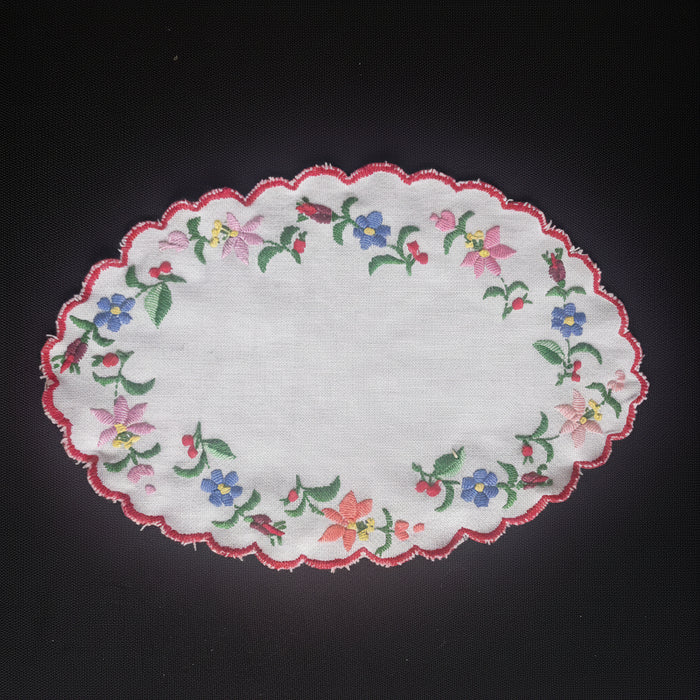 Embroidered floral doily on a black background from Kalocsa, Hungary, Europe