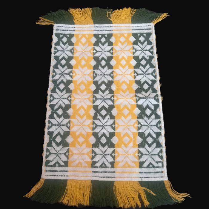 vintage hungarian folk art textile with geometric pattern on a black background