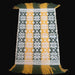 vintage hungarian folk art textile with geometric pattern on a black background