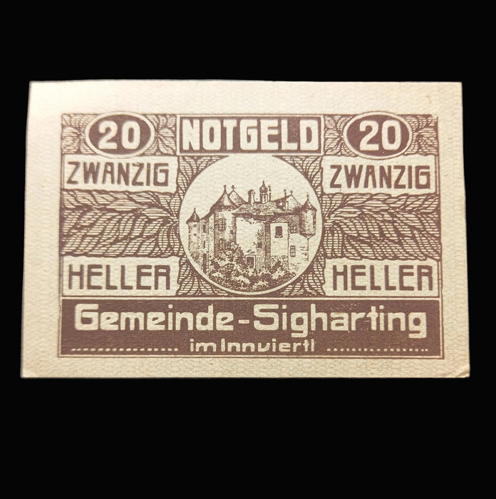 Vintage Notgeld banknote from Gemeinde-Sigharting with castle illustration on a black background