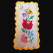 Embroidered floral linen vintage hungarian kalocsai with scalloped edge on a dark background