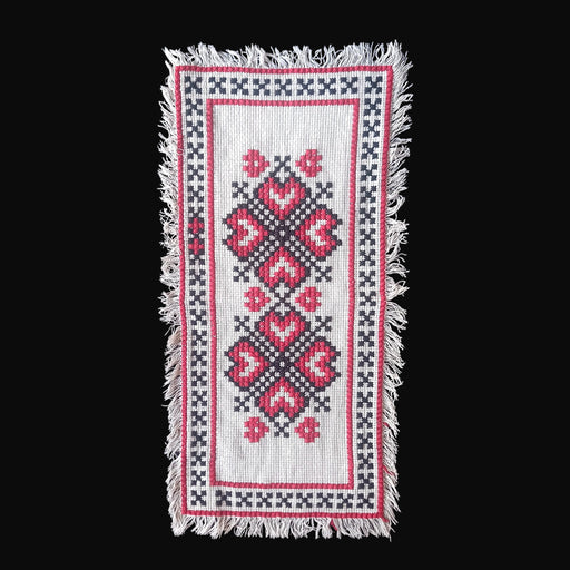 Vintage hungarian beregi folk art table runner with red hearts and black x patterns and fringed border