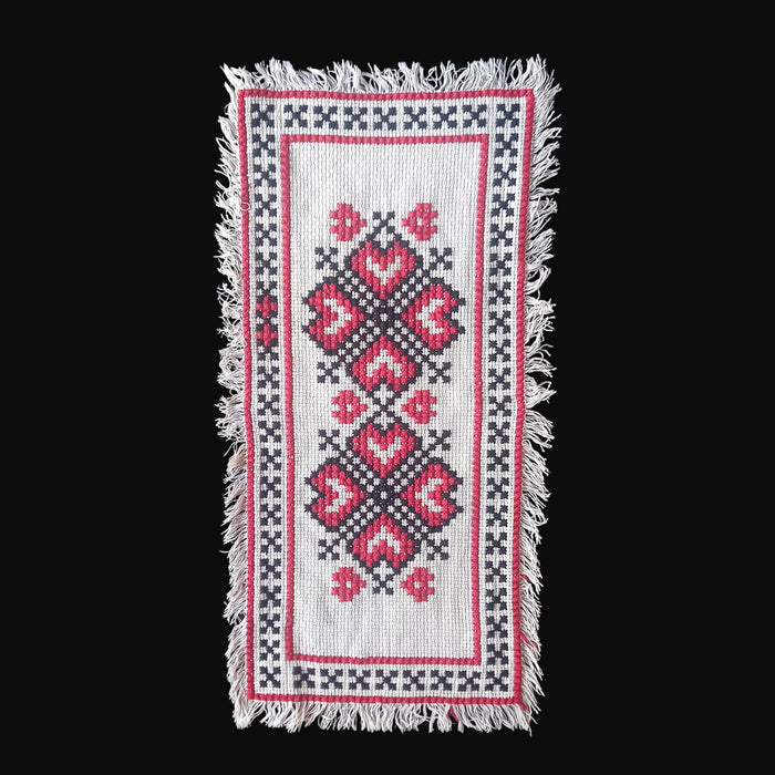 Vintage hungarian beregi folk art table runner with red hearts and black x patterns and fringed border