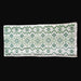 Vintage Hungarian folk art table runner Textile with green geometric pattern on a black surface
