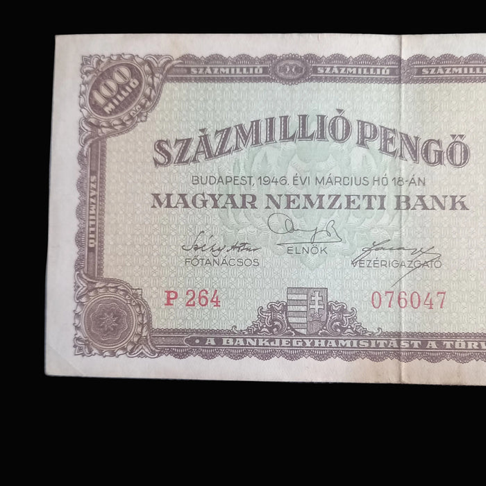 Vintage Hungarian banknote with intricate design and text on a textured surface