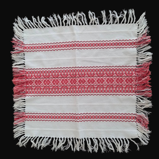Handmade Hungarian Textile with red and white patterns on a dark background, from 1970s vintage