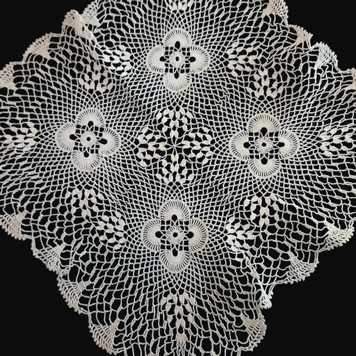 Decorative Hungarian lace doily with intricate patterns on a dark background