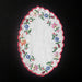 Embroidered Kalocsai Hungarian folk art vintage doily with floral patterns on a black background