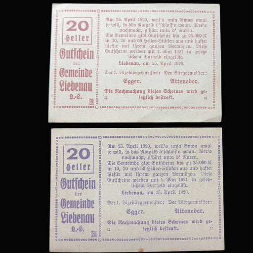 Two identical old German banknotes on a black background
