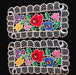 Two embroidered floral doilies with colorful flowers on a black background