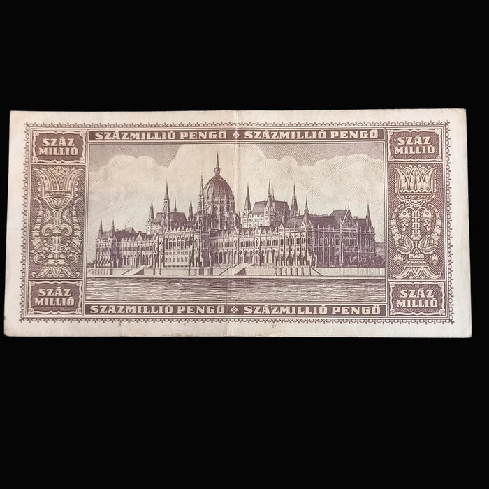Vintage Hungarian banknote with architectural design on a dark background