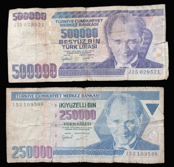 Two vintage Turkish Lira banknotes from the Turkish Republic Central Bank, one 500,000 Lira and one 250,000 Lira, displayed flat against a dark background.