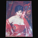 Vintage ephemera from Hungarian A  Pesti Hirlap Vasarnapja 1930 of a woman in a red dress with floral background