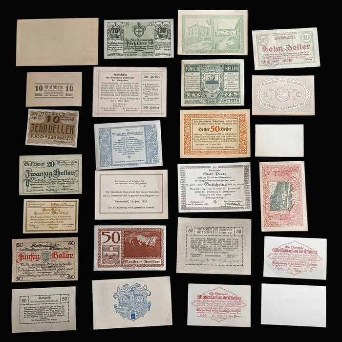 Collection of vintage German banknotes displayed on a dark background