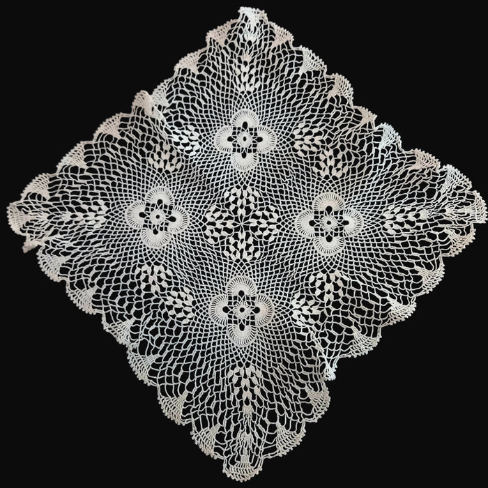Vintage European White lace doily handmade in Hungary on a black background