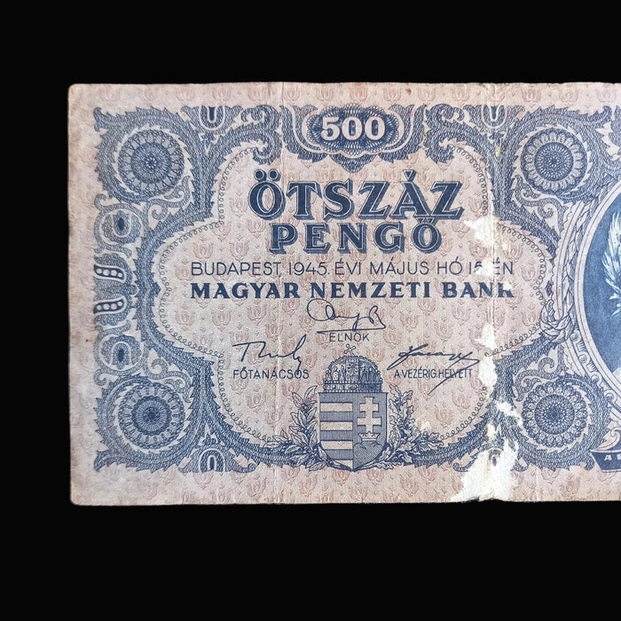 Vintage Hungarian pengó banknote with intricate design on a dark background