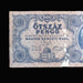 Vintage Hungarian pengó banknote with intricate design on a dark background
