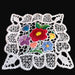 Decorative lace vintage doily with colorful flowers on a black background from Hungary Central Europe