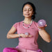 woman meditating with rose quartz crystals