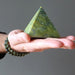 hand wearing and holding serpentine stones