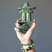 hand wearing and holding serpentine stones