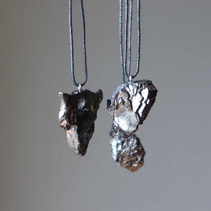three raw elite shungite stone necklaces