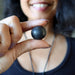 shungite tumbled stone at throat chakra