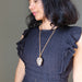 Woman wearing smoky quartz macrame necklace