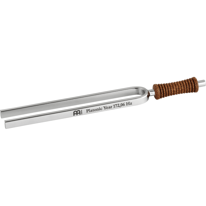 Tuning fork with metallic design and brown handle on a gray background